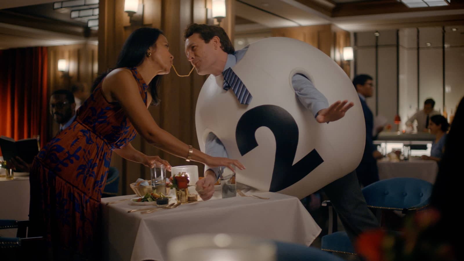 A woman and a Powerball eat spaghetti