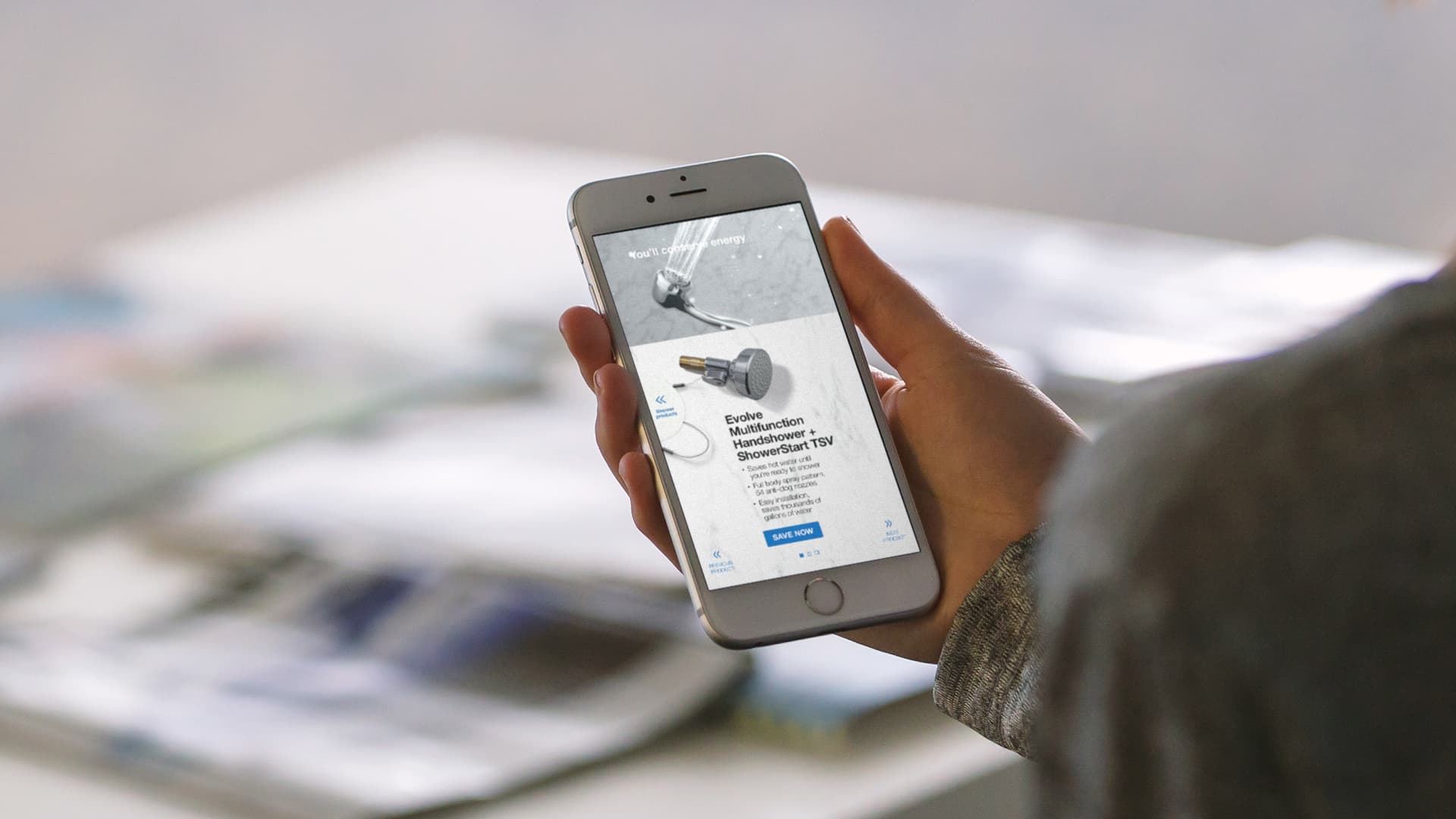 A hand holding a National Grid rich media unit ad on a smart phone