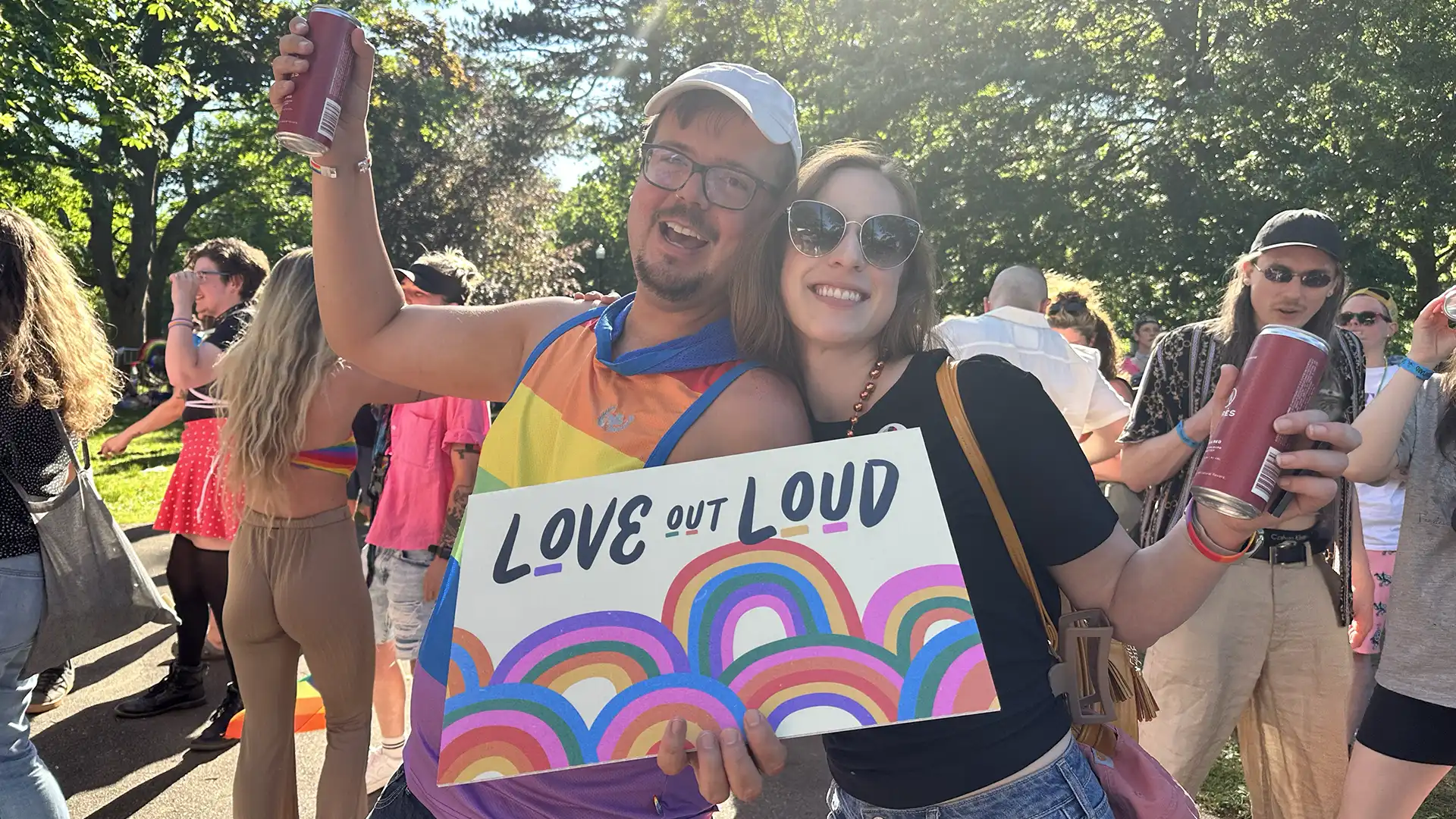 Pride parade goers with posters