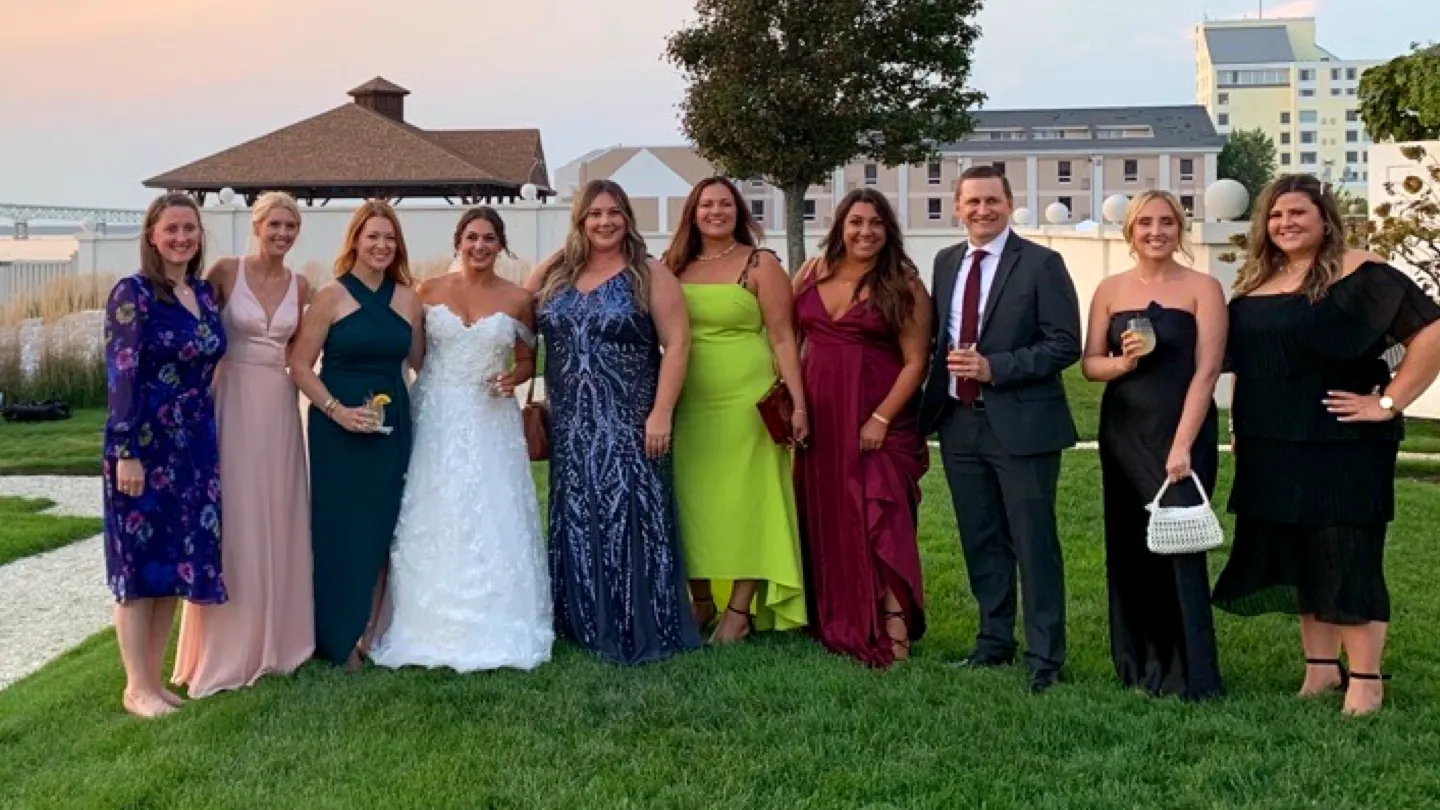 Team members at a wedding