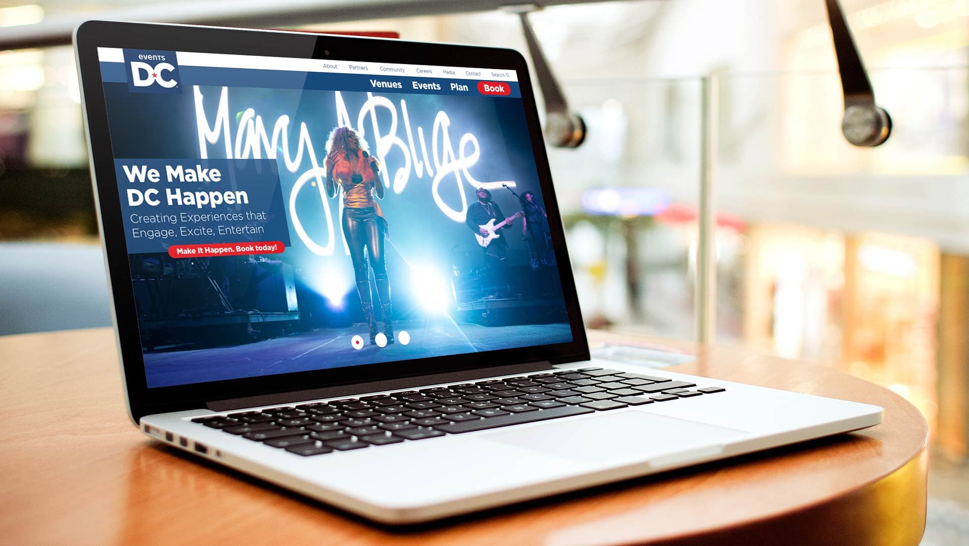 Events DC homepage on laptop with MJ Blige concert featured