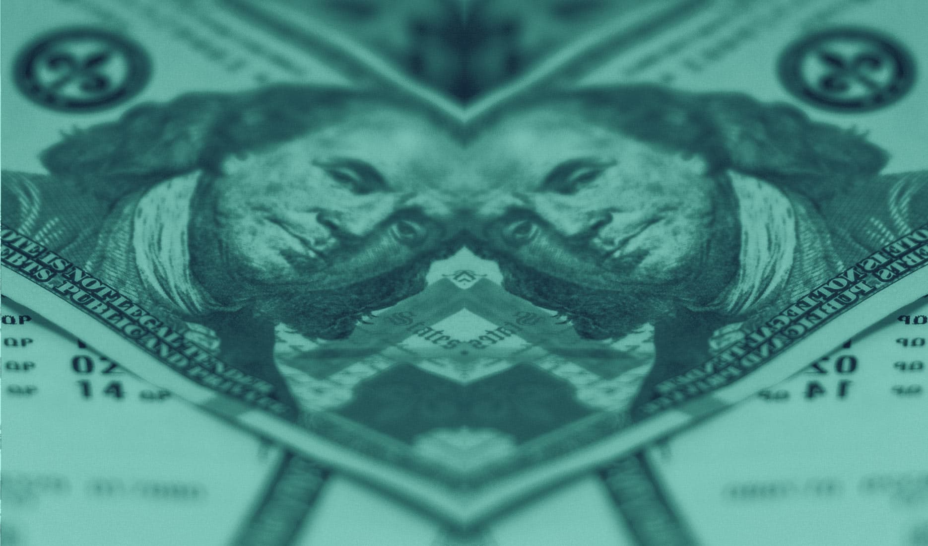 A close up of money laying over lottery tickets