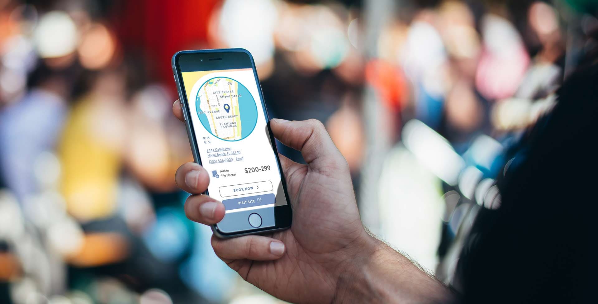 A hand holding a phone with a map