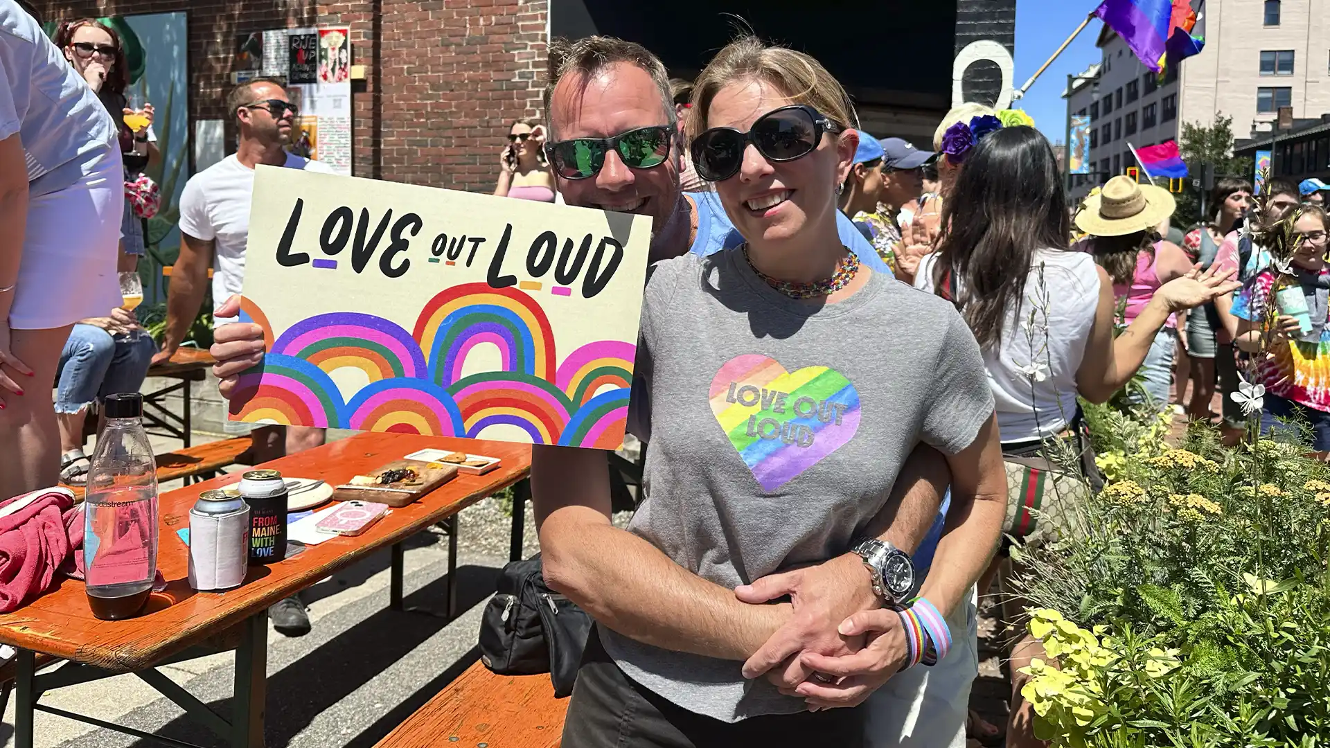 Pride parade goers with posters