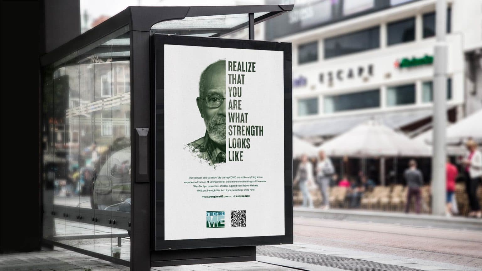 An out-of-home ad featuring a man, with half of his face visible. The other half displays a headline."