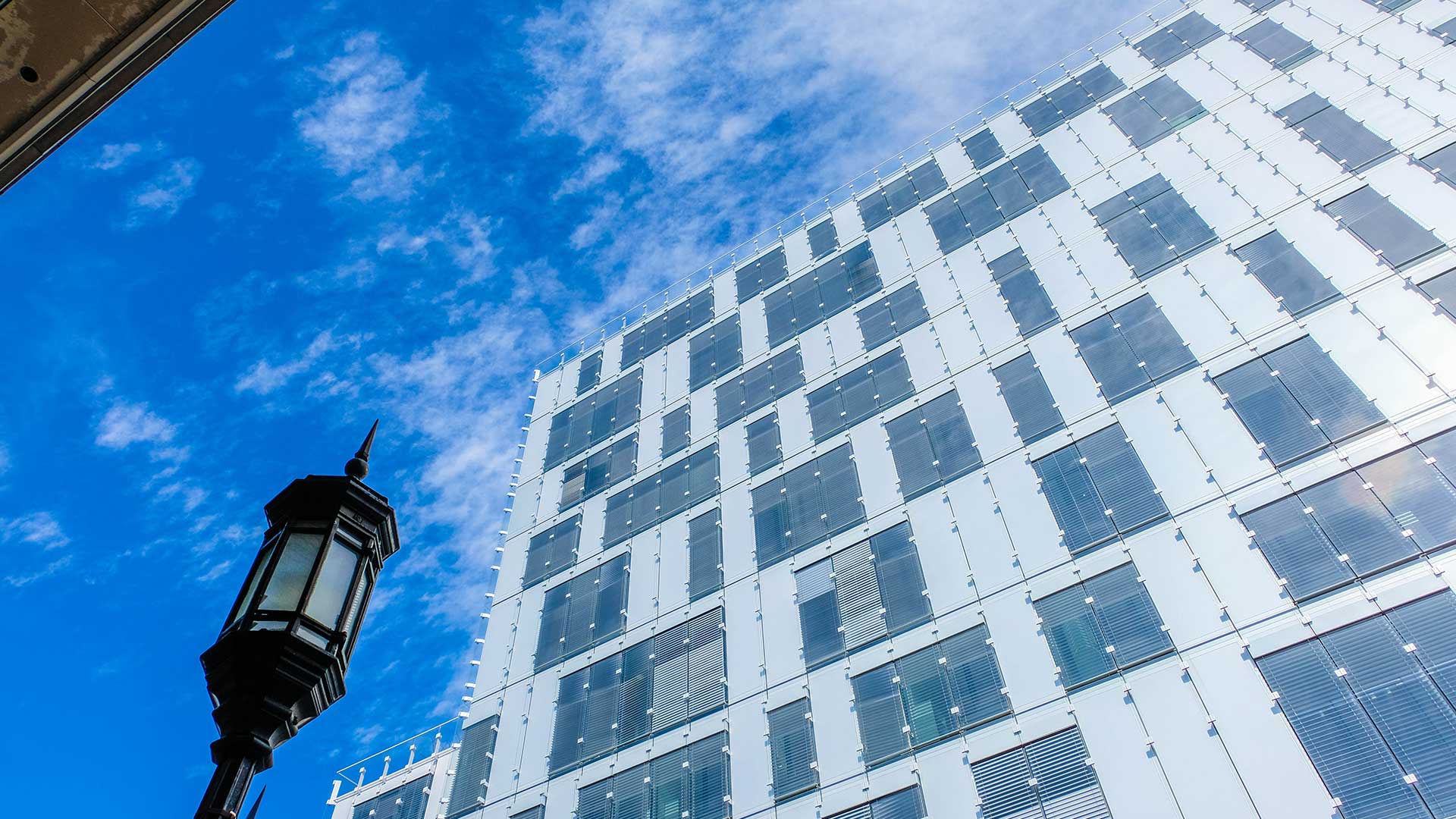 A skyscraper set against a blue sky.