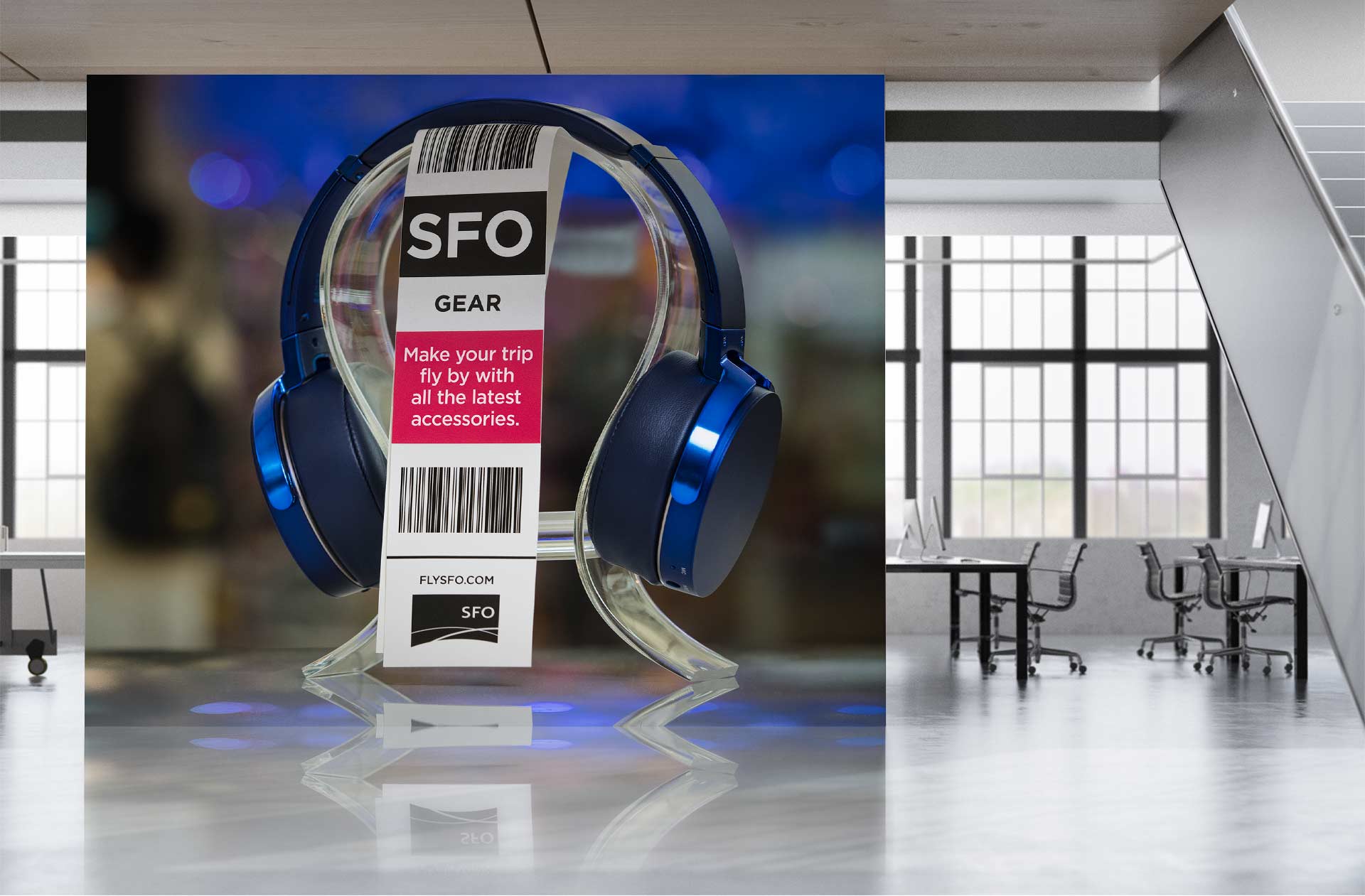 Out-of-home placement. Headphones with checked bag tag displaying headline.