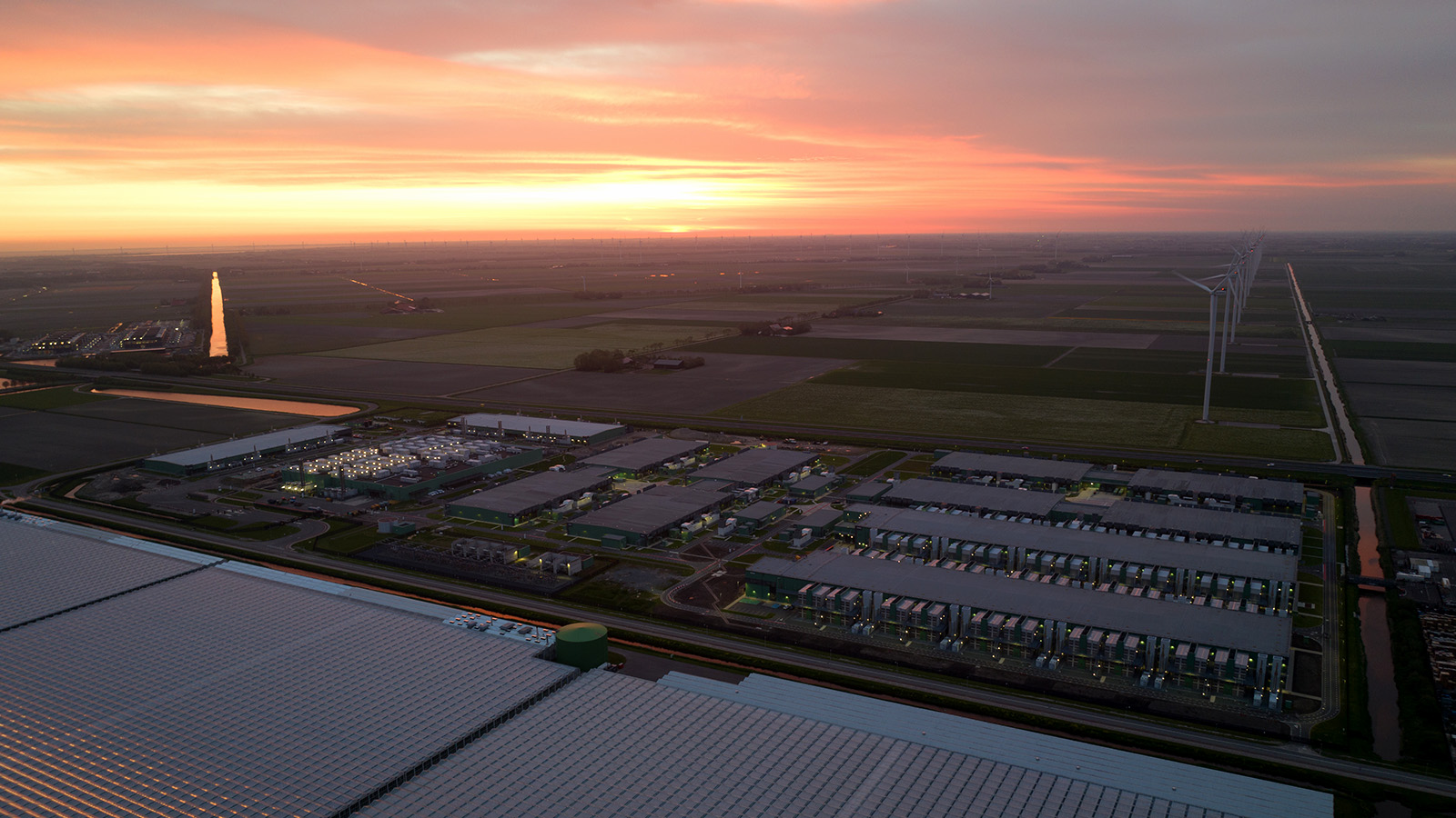 A server farm with the sunset in the background